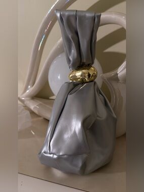 A Classy Chic Boutique Silver Mini Knot Bag with Gold Accent